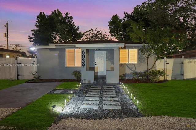 6039 SW 38th St, Miramar, FL 33023 - bungalow with stucco siding and a gate
