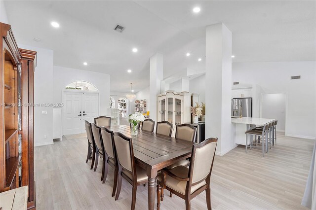 4647 NW 98th Ln, Coral Springs, FL 33076 - dining space featuring vaulted ceiling, light wood-type flooring, and recessed lighting
