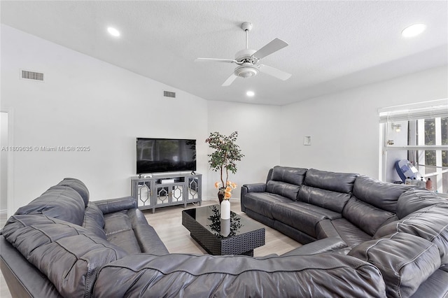 4647 NW 98th Ln, Coral Springs, FL 33076 - living room featuring ceiling fan, a textured ceiling, lofted ceiling, recessed lighting, and light wood-type flooring