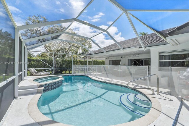 4647 NW 98th Ln, Coral Springs, FL 33076 - view of swimming pool with ceiling fan, a pool with connected hot tub, a patio, and a lanai