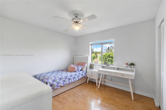 4647 NW 98th Ln, Coral Springs, FL 33076 - bedroom featuring wood finished floors and a ceiling fan