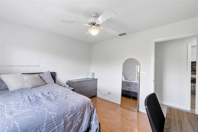 4647 NW 98th Ln, Coral Springs, FL 33076 - bedroom with wood finished floors and ceiling fan