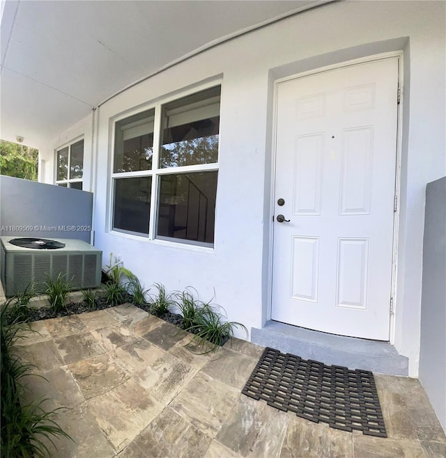 3025 Mary St Unit 5, Miami, FL 33133 - entrance to property with cooling unit and stucco siding