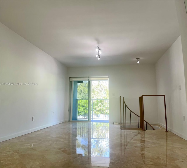 3025 Mary St Unit 5, Miami, FL 33133 - empty room with baseboards and marble tiled floors
