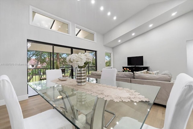 7932 Seville Pl Unit 2104, Boca Raton, FL 33433 - dining room featuring a high ceiling, light wood-type flooring, recessed lighting, and baseboards