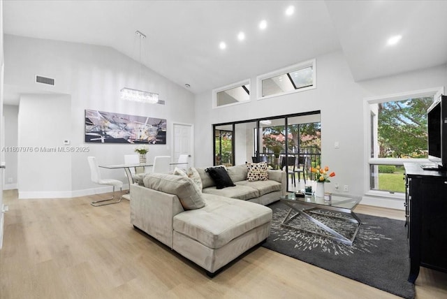 7932 Seville Pl Unit 2104, Boca Raton, FL 33433 - living room featuring high vaulted ceiling, wood finished floors, a chandelier, recessed lighting, and baseboards