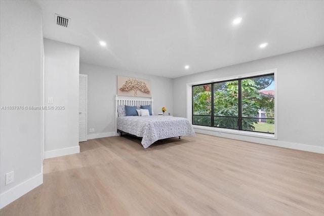 7932 Seville Pl Unit 2104, Boca Raton, FL 33433 - bedroom with light wood-style flooring, baseboards, and recessed lighting