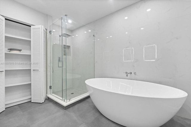 7932 Seville Pl Unit 2104, Boca Raton, FL 33433 - full bathroom featuring a stall shower, a freestanding bath, and recessed lighting