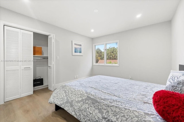 7932 Seville Pl Unit 2104, Boca Raton, FL 33433 - bedroom featuring recessed lighting, wood finished floors, a closet, and baseboards