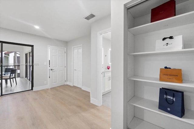 7932 Seville Pl Unit 2104, Boca Raton, FL 33433 - hall with light wood-type flooring and baseboards