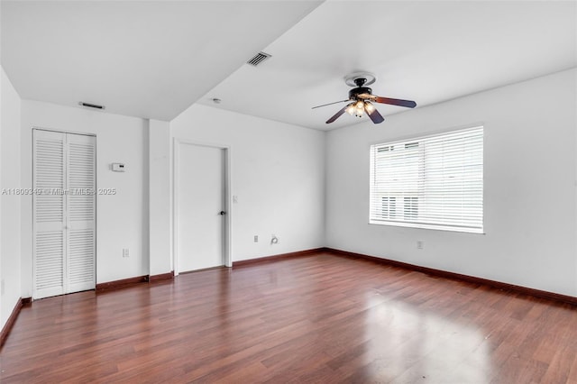 1051 Meridian Ave Unit 1-A, Miami Beach, FL 33139 - unfurnished bedroom with baseboards, dark wood-type flooring, and a ceiling fan