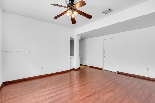 1051 Meridian Ave Unit 1-A, Miami Beach, FL 33139 - spare room featuring a ceiling fan, light wood-type flooring, and baseboards
