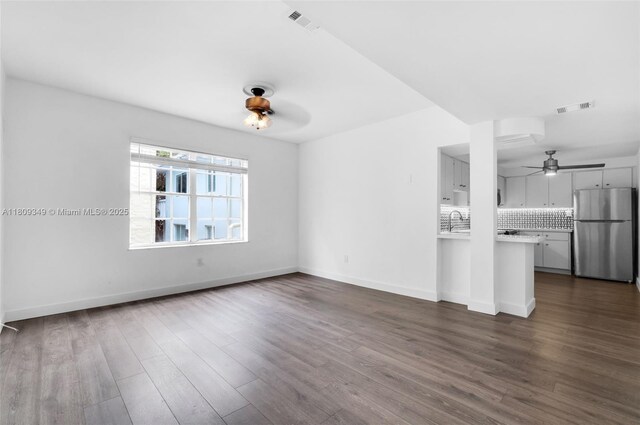 1051 Meridian Ave Unit 1-A, Miami Beach, FL 33139 - unfurnished living room with a ceiling fan and dark wood-type flooring