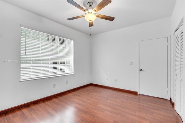 1051 Meridian Ave Unit 1-A, Miami Beach, FL 33139 - unfurnished room with wood finished floors, a ceiling fan, and baseboards