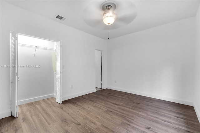 1051 Meridian Ave Unit 1-A, Miami Beach, FL 33139 - unfurnished bedroom with wood finished floors and ceiling fan
