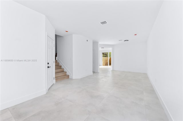 1470 SE 26th Ave, Homestead, FL 33035 - empty room with baseboards, stairway, and concrete floors
