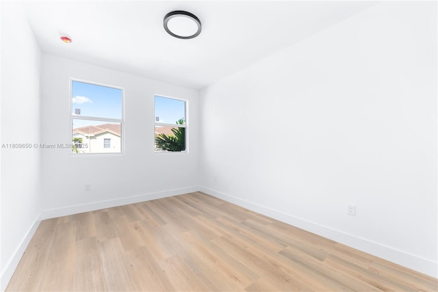 1470 SE 26th Ave, Homestead, FL 33035 - unfurnished room featuring light wood-style floors and baseboards