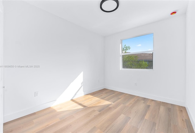 1470 SE 26th Ave, Homestead, FL 33035 - unfurnished room with baseboards and wood finished floors