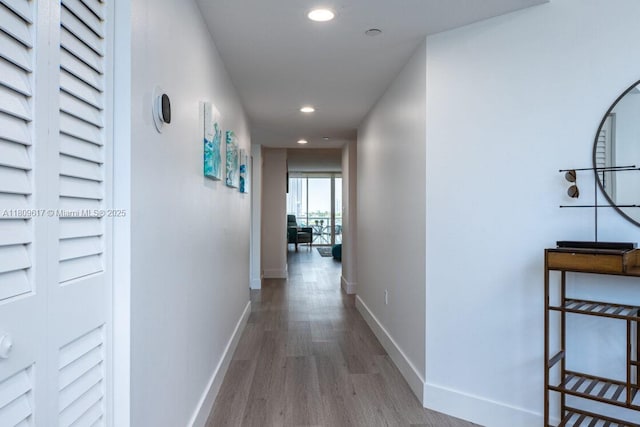 17050 N Bay Rd Unit 401, Sunny Isles Beach, FL 33160 - hall featuring recessed lighting, wood finished floors, and baseboards