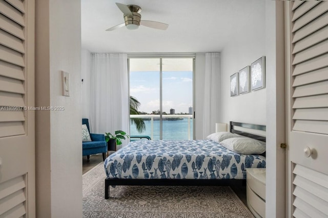 17050 N Bay Rd Unit 401, Sunny Isles Beach, FL 33160 - bedroom with access to exterior, floor to ceiling windows, a water view, and ceiling fan