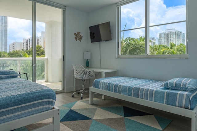 17050 N Bay Rd Unit 401, Sunny Isles Beach, FL 33160 - bedroom featuring wood finished floors and floor to ceiling windows