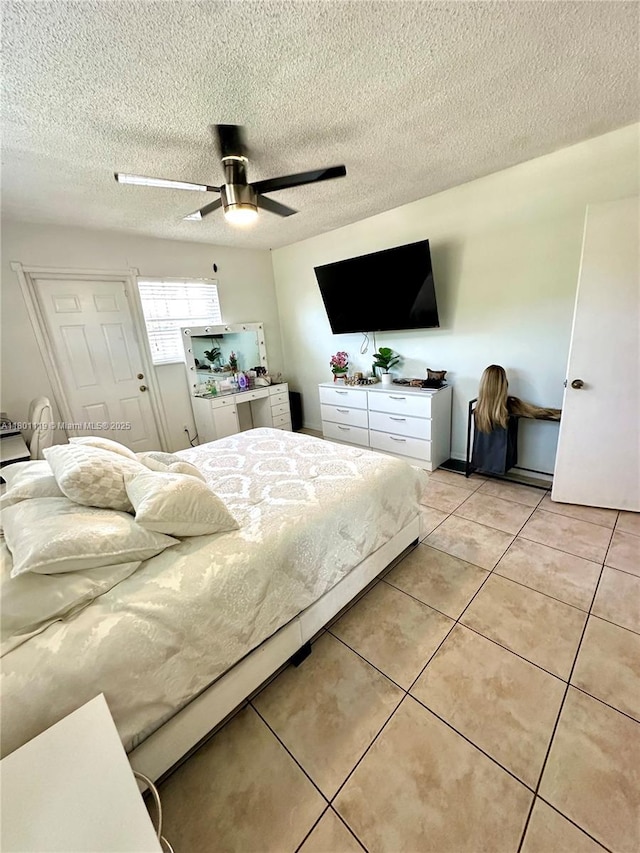 21000 NE 26th Ave, Miami, FL 33180 - bedroom featuring light tile patterned floors, a ceiling fan, and a textured ceiling