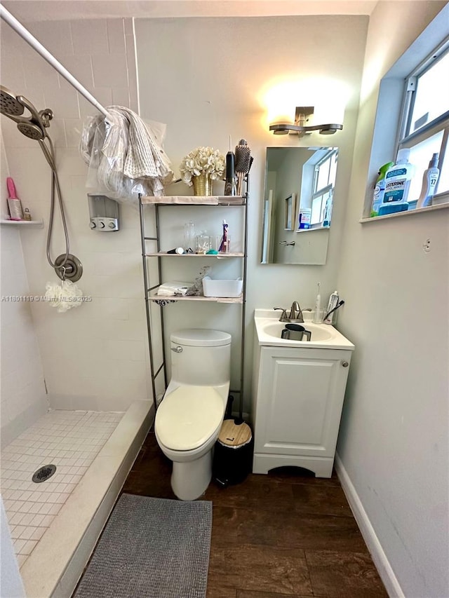 21000 NE 26th Ave, Miami, FL 33180 - full bathroom featuring a shower stall, toilet, vanity, and baseboards