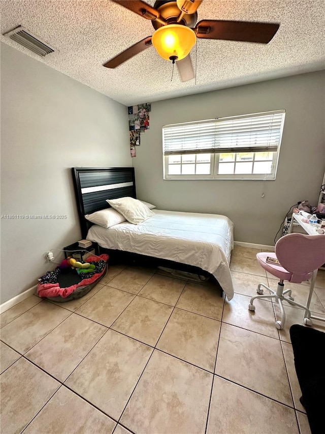 21000 NE 26th Ave, Miami, FL 33180 - tiled bedroom featuring a textured ceiling and ceiling fan
