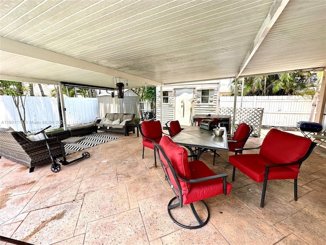 21000 NE 26th Ave, Miami, FL 33180 - fenced backyard with a patio, an outdoor hangout area, and outdoor dining area