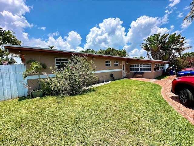 21000 NE 26th Ave, Miami, FL 33180 - rear view of house with stucco siding