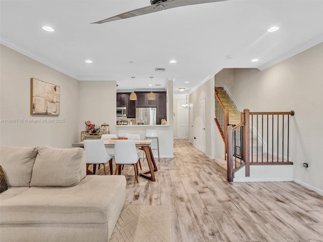 5907 Monterra Club Dr, Lake Worth, FL 33463 - living area featuring crown molding, stairway, light wood-style flooring, recessed lighting, and baseboards