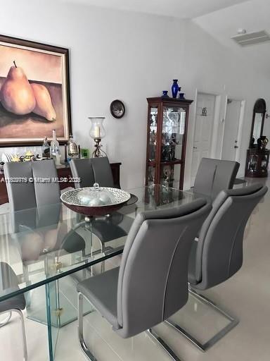 21080 SW 242nd St, Homestead, FL 33031 - dining room featuring lofted ceiling