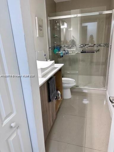 21080 SW 242nd St, Homestead, FL 33031 - full bath with tile patterned floors, vanity, toilet, and a stall shower