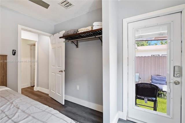 37 NW 47th Ter, Miami, FL 33127 - bedroom with dark wood-style flooring and baseboards