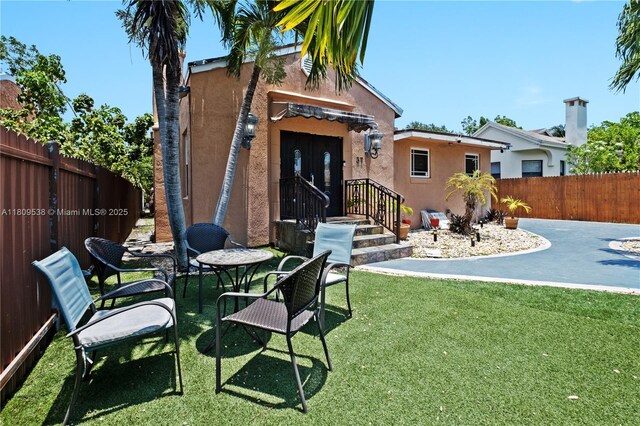 37 NW 47th Ter, Miami, FL 33127 - rear view of property featuring stucco siding