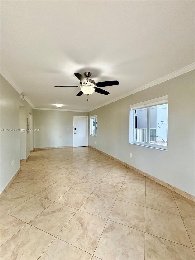 3536 NE 168th St Unit 201, North Miami Beach, FL 33160 - spare room with ornamental molding, ceiling fan, and baseboards