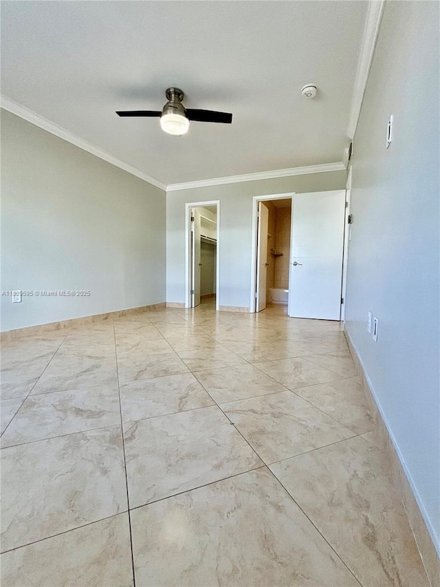 3536 NE 168th St Unit 201, North Miami Beach, FL 33160 - unfurnished bedroom with ornamental molding, a spacious closet, baseboards, a ceiling fan, and light marble finish flooring