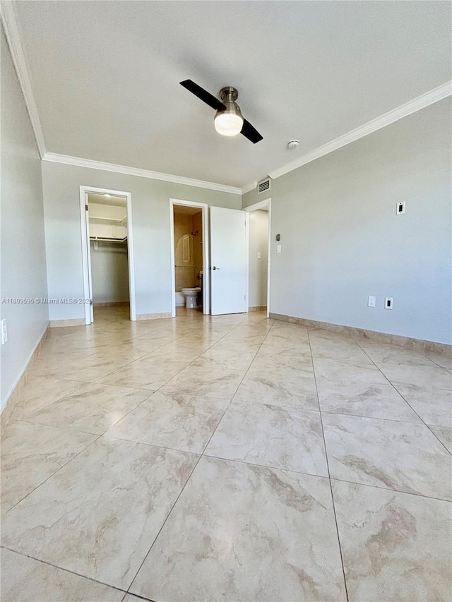 3536 NE 168th St Unit 201, North Miami Beach, FL 33160 - unfurnished bedroom featuring crown molding, light marble finish floors, baseboards, ceiling fan, and a walk in closet