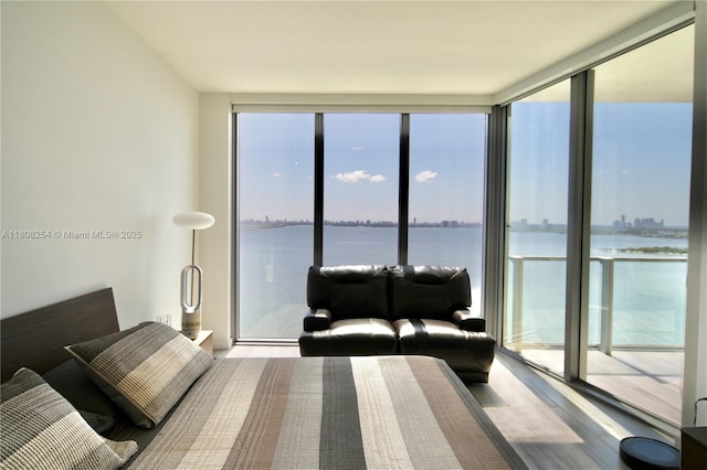 2900 NE 7th Ave Unit 2105, Miami, FL 33137 - bedroom with a wall of windows, wood finished floors, a water view, and access to outside