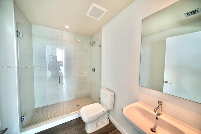 2900 NE 7th Ave Unit 2105, Miami, FL 33137 - full bath featuring toilet, a shower stall, wood finished floors, and recessed lighting