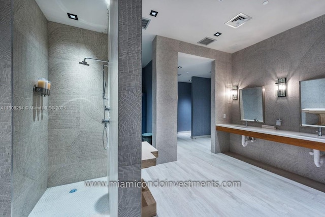 2900 NE 7th Ave Unit 2105, Miami, FL 33137 - full bath featuring wood finished floors, tiled shower, and double vanity