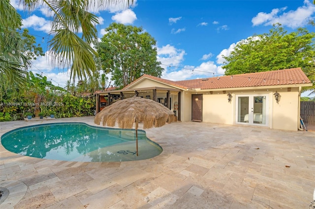 641 SW 50th Ave, Margate, FL 33068 - swimming pool with french doors and a patio area