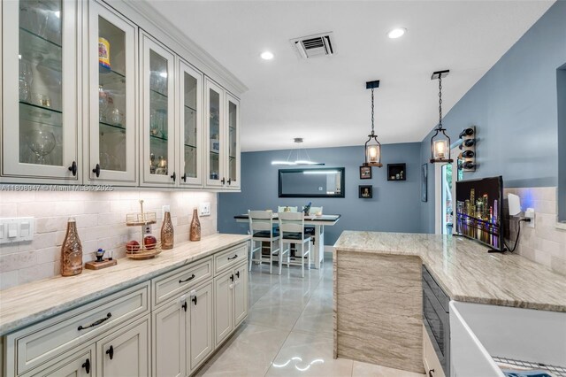 641 SW 50th Ave, Margate, FL 33068 - bar area with decorative backsplash, hanging light fixtures, and recessed lighting
