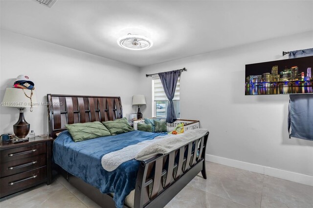 641 SW 50th Ave, Margate, FL 33068 - bedroom with baseboards and light tile patterned floors