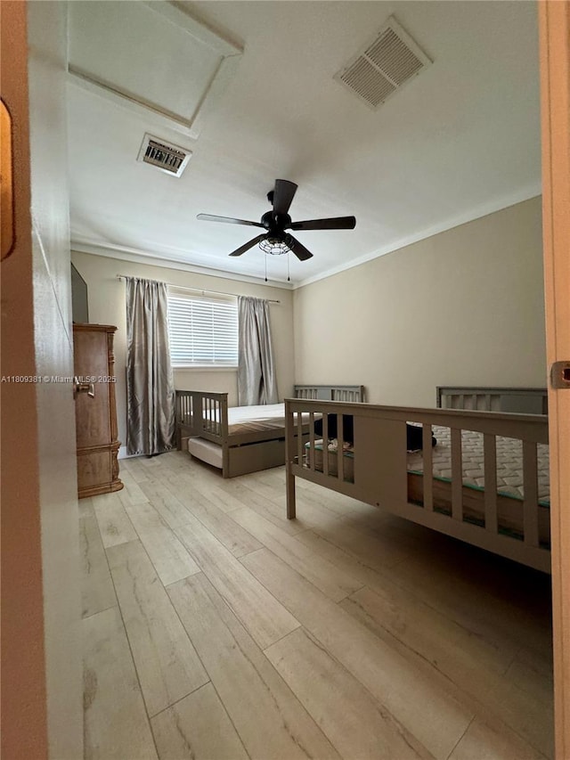 2200 Monroe St Unit 33, Hollywood, FL 33020 - unfurnished bedroom with ornamental molding, wood finished floors, attic access, and a ceiling fan
