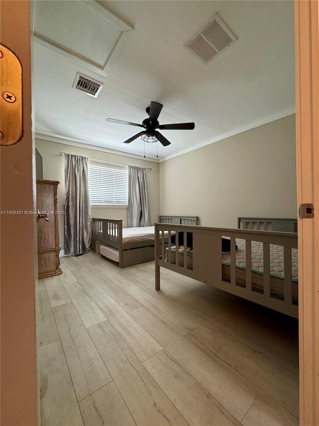2200 Monroe St Unit 33, Hollywood, FL 33020 - unfurnished bedroom with crown molding, wood finished floors, attic access, and ceiling fan