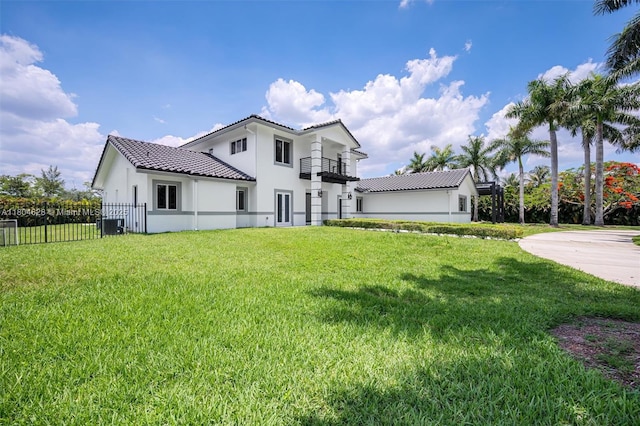 5121 SW 210th Ter, Southwest Ranches, FL 33332 - back of property featuring a balcony, a tile roof, stucco siding, and central AC