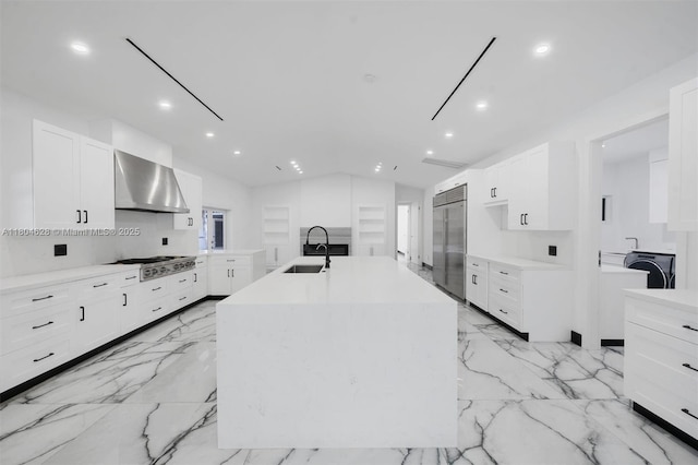 5121 SW 210th Ter, Southwest Ranches, FL 33332 - kitchen featuring wall chimney range hood, stainless steel appliances, a sink, recessed lighting, and a kitchen island with sink