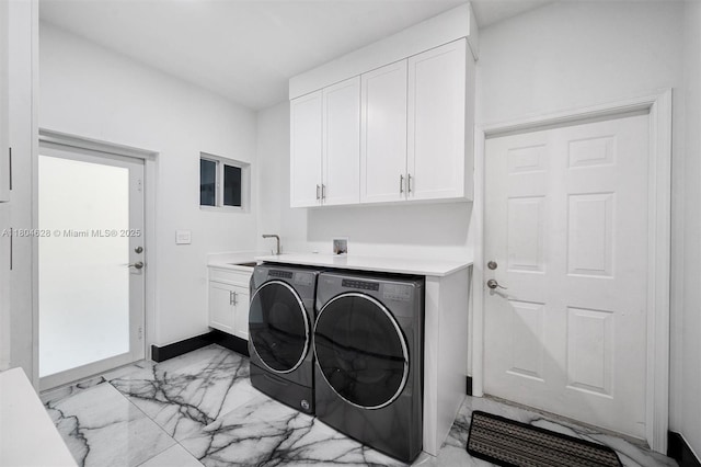 5121 SW 210th Ter, Southwest Ranches, FL 33332 - laundry area featuring light marble finish flooring, washing machine and dryer, cabinet space, and baseboards