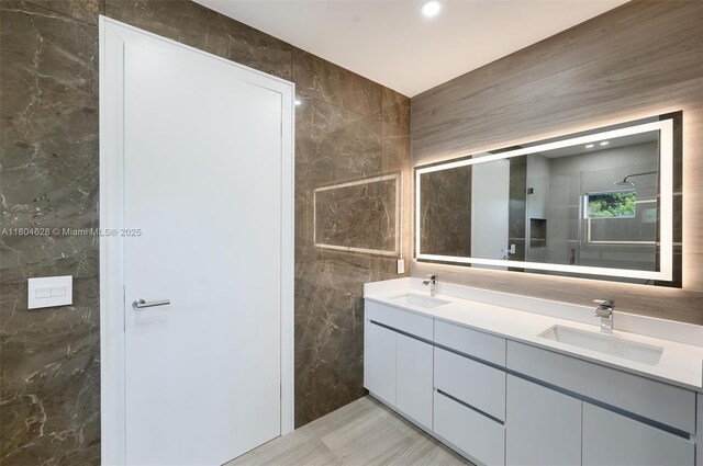 5121 SW 210th Ter, Southwest Ranches, FL 33332 - bathroom with double vanity, tile walls, and a shower